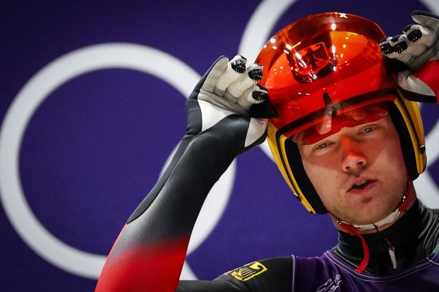 Germany's Max Langenhan reacts as he takes the start to compete in the luge men's singles run 1 at Cortina Sliding Centre during the Milano Cortina 2026 Winter Olympic Games in Cortina d'Ampezzo on February 7, 2026. (Photo by FRANCK FIFE / AFP)