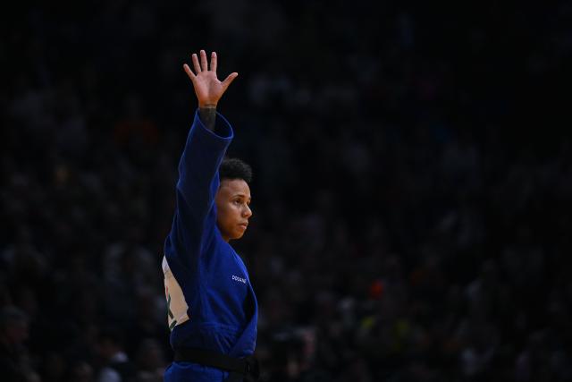 France's Amandine Buchard celebrates after winning against South Korea's Seyung Jang in the women's -52kg Bronze medal bout at the Paris Grand Slam judo tournament in Paris on February 7, 2026. (Photo by Julie SEBADELHA / AFP)