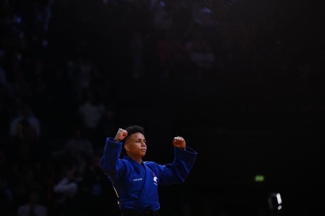 France's Amandine Buchard celebrates after winning against South Korea's Seyung Jang in the women's -52kg Bronze medal bout at the Paris Grand Slam judo tournament in Paris on February 7, 2026. (Photo by Julie SEBADELHA / AFP)