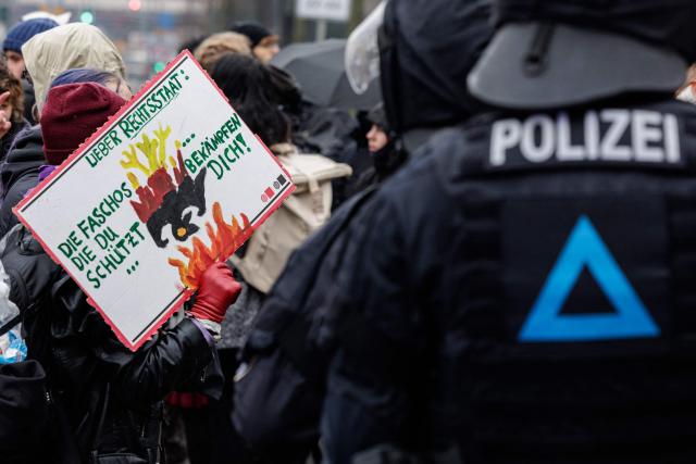 Supporters of German anti-fascist activist Maja T, who was sentenced to eight years in prison in Budapest, take part in a demonstration in support of her on February 7, 2026 in Jena, eastern Germany. The 25-year-old non-binary person was sentenced in Budapest to eight years in prison for an attack on right-wing extremists in February 2023 in Hungary. The trial was controversial because Maja T. had been extradited from Germany to Hungary, which is governed by a right-wing nationalist administration, despite an urgent appeal before the Federal Constitutional Court. (Photo by JENS SCHLUETER / AFP)