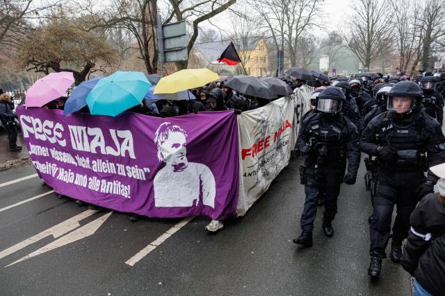 Supporters of German anti-fascist activist Maja T, who was sentenced to eight years in prison in Budapest, take part in a demonstration in support of her on February 7, 2026 in Jena, eastern Germany. The 25-year-old non-binary person was sentenced in Budapest to eight years in prison for an attack on right-wing extremists in February 2023 in Hungary. The trial was controversial because Maja T. had been extradited from Germany to Hungary, which is governed by a right-wing nationalist administration, despite an urgent appeal before the Federal Constitutional Court. (Photo by JENS SCHLUETER / AFP)