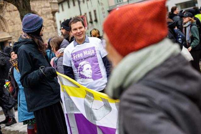 Father Wolfram Jarosch of German anti-fascist activist Maja T, who was sentenced to eight years in prison in Budapest, attends a demonstration in support of her on February 7, 2026 in Jena, eastern Germany. The 25-year-old non-binary person was sentenced in Budapest to eight years in prison for an attack on right-wing extremists in February 2023 in Hungary. The trial was controversial because Maja T. had been extradited from Germany to Hungary, which is governed by a right-wing nationalist administration, despite an urgent appeal before the Federal Constitutional Court. (Photo by JENS SCHLUETER / AFP)