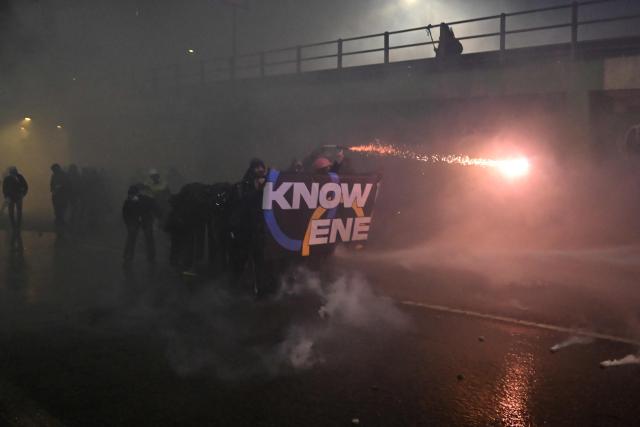 People clash with police during a protest against the environmental, economic and social impact of the Milano-Cortina 2026 Winter Olympics Games, in Milan on February 7, 2026. (Photo by PIERO CRUCIATTI / AFP)
