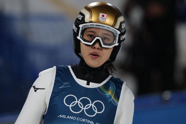 Japan's Nozomi Maruyama reacts after a jump during the women's ski jumping normal hill individual trial round of the Milano Cortina 2026 Winter Olympic Games at Predazzo Ski Jumping Stadium in Predazzo (Val di Fiemme), on February 7, 2026. (Photo by Anne-Christine POUJOULAT / AFP)