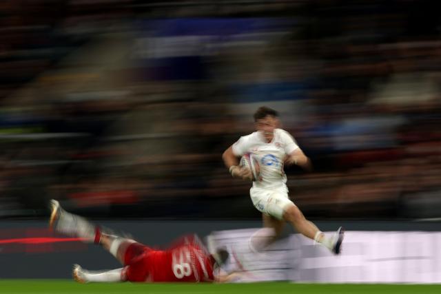 England's wing Henry Arundell runs with the ball to score the teams fourth try during the Six Nations international rugby union match between England and Wales at Allianz Stadium, Twickenham, in south-west London, on February 7, 2026. (Photo by Adrian Dennis / AFP)