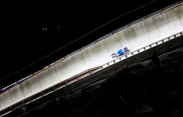 Slovakia's Jozef Ninis competes in the luge men's singles run 2 at Cortina Sliding Centre during the Milano Cortina 2026 Winter Olympic Games in Cortina d'Ampezzo on February 7, 2026. (Photo by FRANCK FIFE / AFP)