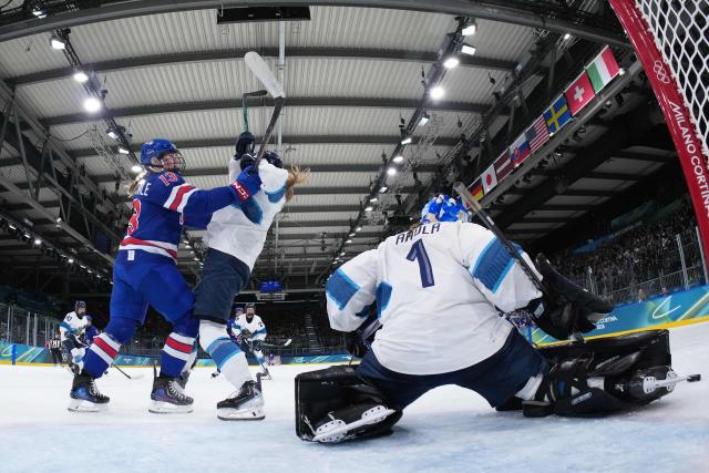 US' forward #13 Grace Zumwinkle (L) collides with Finland's #07 Sanni Rantala (2nd L)  during the women's preliminary round Group A Ice Hockey match between USA and Finland at the Milano Rho Ice Hockey Arena at the Milano Cortina 2026 Winter Olympic Games in Milan, on February 7, 2026. (Photo by Sun Fei / AFP)