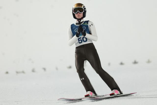 Slovenia's Nika Prevc arrives in the finish area after jumping during the women's ski jumping normal hill individual 1st round of the Milano Cortina 2026 Winter Olympic Games at Predazzo Ski Jumping Stadium in Predazzo (Val di Fiemme), on February 7, 2026. (Photo by Anne-Christine POUJOULAT / AFP)