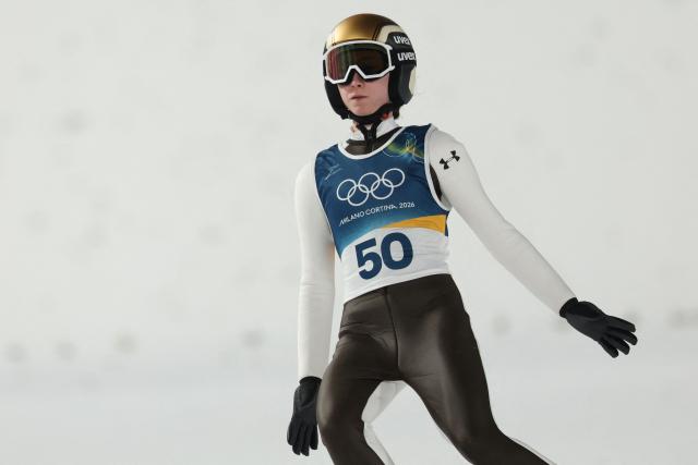 Slovenia's Nika Prevc arrives in the finish area after jumping during the women's ski jumping normal hill individual 1st round of the Milano Cortina 2026 Winter Olympic Games at Predazzo Ski Jumping Stadium in Predazzo (Val di Fiemme), on February 7, 2026. (Photo by Anne-Christine POUJOULAT / AFP)