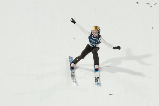 Slovenia's Nika Prevc lands after jumping during the women's ski jumping normal hill individual 1st round of the Milano Cortina 2026 Winter Olympic Games at Predazzo Ski Jumping Stadium in Predazzo (Val di Fiemme), on February 7, 2026. (Photo by Anne-Christine POUJOULAT / AFP)