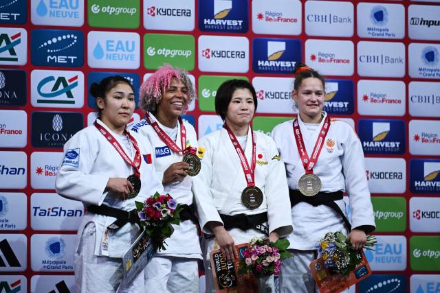 Gold medallist Brazil's Rafaela Silva (2L) stands next to silver medallist Mongolia's Enkhriilen Lkhagvatogoo (L) and bronze medallists Japan's Kirari Yamaguchi (2R) and Netherland's joanne Van Lieshout in podium of the women's -63kg Final at the Paris Grand Slam judo tournament in Paris on February 7, 2026. (Photo by Julie SEBADELHA / AFP)