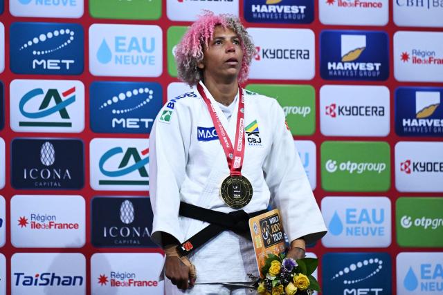 Gold medallist Brazil's Rafaela Silva stands on the podium of the women's -63kg Final at the Paris Grand Slam judo tournament in Paris on February 7, 2026. (Photo by Julie SEBADELHA / AFP)