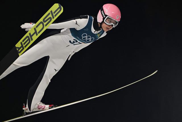 Japan's Yuka Seto jumps during the women's ski jumping normal hill individual final round of the Milano Cortina 2026 Winter Olympic Games at Predazzo Ski Jumping Stadium in Predazzo (Val di Fiemme), on February 7, 2026. (Photo by Javier SORIANO / AFP)