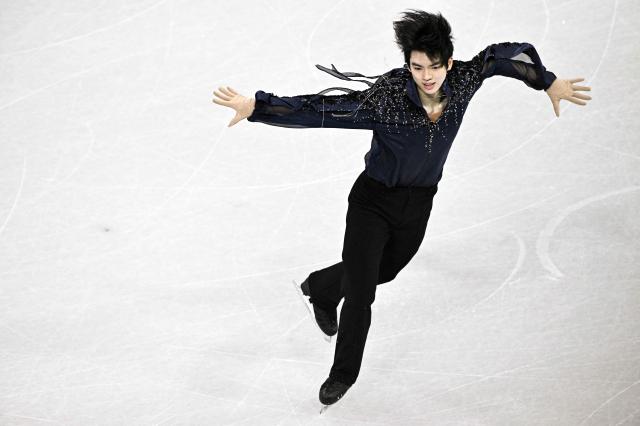 South Korea's Cha Junhwan competes in the figure skating team event men's singles short program during the Milano Cortina 2026 Winter Olympic Games at Milano Ice Skating Arena in Milan on February 7, 2026. (Photo by JULIEN DE ROSA / AFP)