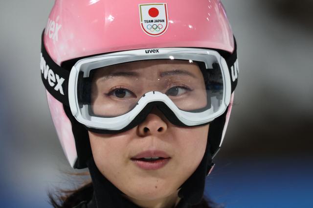 Japan's Yuka Seto reacts after a jump during the women's ski jumping normal hill individual final round of the Milano Cortina 2026 Winter Olympic Games at Predazzo Ski Jumping Stadium in Predazzo (Val di Fiemme), on February 7, 2026. (Photo by Anne-Christine POUJOULAT / AFP)