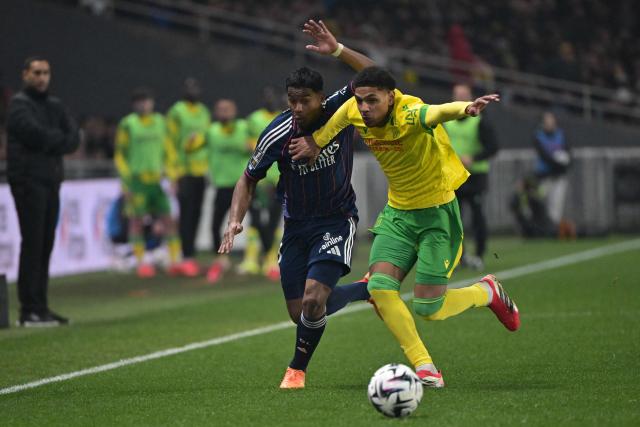 Nantes’ French midfielder #17 Dehmaine Tabibou Assoumani (R) fights for the ball with Lyon’s Brazilian forward #09 Endrick during the French L1 football match between FC Nantes and Olympique Lyonnais (OL) at the Stade de la Beaujoire–Louis Fonteneau in Nantes, western France on February 7, 2026. (Photo by Damien MEYER / AFP)