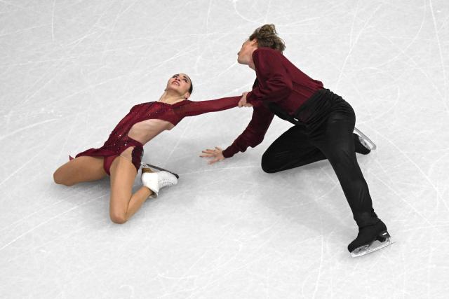 Georgia's Diana Davis (L) and Georgia's Gleb Smolkin (R) compete in the figure skating team event ice dance-free dance during the Milano Cortina 2026 Winter Olympic Games at Milano Ice Skating Arena in Milan on February 7, 2026. (Photo by Antonin THUILLIER / AFP)