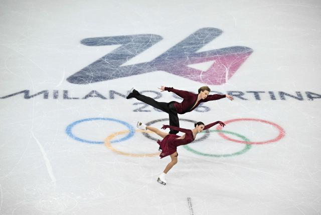 Georgia's Diana Davis (bottom) and Georgia's Gleb Smolkin compete in the figure skating team event ice dance-free dance during the Milano Cortina 2026 Winter Olympic Games at Milano Ice Skating Arena in Milan on February 7, 2026. (Photo by JULIEN DE ROSA / AFP)