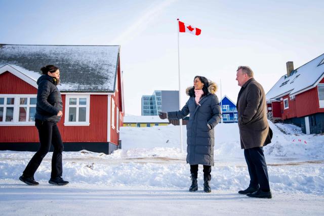 Danish Foreign Minister Lars Loekke Rasmussen, Greenland Minister for Foreign Affairs  Vivian Motzfeldt, and Canadian Foreign Minister Anita Anand meet in front of the newly opened Canadian consulate in Nuuk, Greenland, on February 7, 2026. Canada, which opposes US President Donald Trump's claim to Greenland, opened a consulate in the Danish autonomous territory's capital on February 6, in a show of support for the local government. (Photo by Ida Marie Odgaard / Ritzau Scanpix / AFP) / Denmark OUT