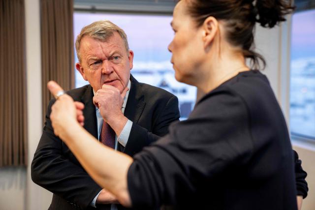 Danish Foreign Minister Lars Loekke Rasmussen and Greenland Minister for Foreign Affairs, Vivian Motzfeldt, speak at a meeting in Nuuk, Greeland, on February 7, 2026. Canada, which opposes US President Donald Trump's claim to Greenland, opened a consulate in the Danish autonomous territory's capital on February 6, in a show of support for the local government. (Photo by Ida Marie Odgaard / Ritzau Scanpix / AFP) / Denmark OUT