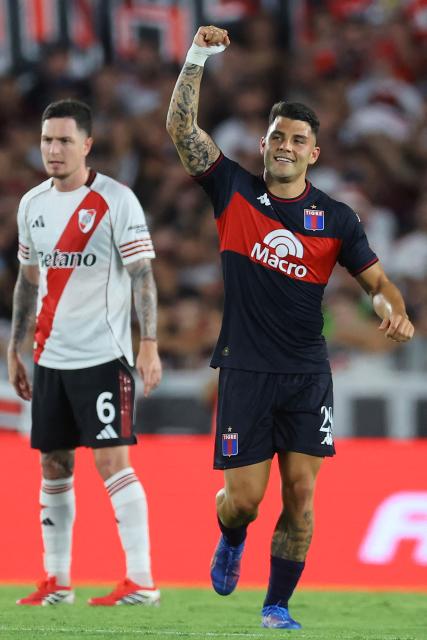 Tigre's forward #29 Ignacio Russo celebrates scoring his team's third goal during the Argentine Professional Football League 2026 Apertura Tournament match between River Plate and Tigre at the Mas Monumental Stadium in Buenos Aires on February 7, 2026. (Photo by ALEJANDRO PAGNI / AFP)