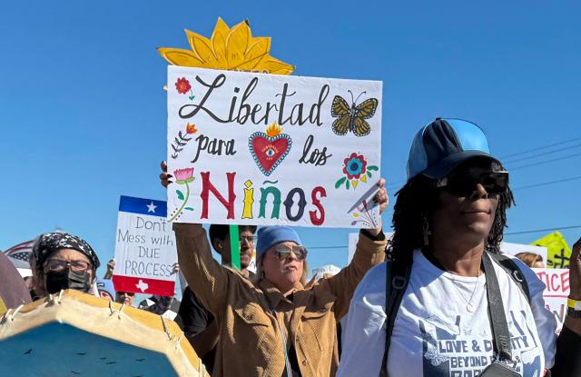 (FILES) A protester holds a sign calling for freedom for children during a demonstration and vigil outside the South Texas Family Residential Center in Dilley, Texas, on January 28, 2026. The detention center in rural Texas has become a harsh symbol of US President Donald Trump's immigration crackdown, with disease running rampant among the throng of people held, including some families who entered the United States legally. (Photo by Moisés ÁVILA / AFP)