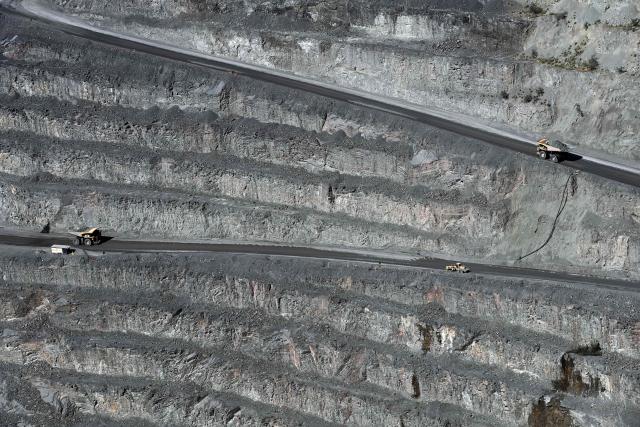 (FILES) A general view of haul trucks carrying ore of the open pit of the Jwaneng Diamond Mine in Jwaneng, Botswana, on May 11, 2023. Even with its legendary image of glitz and glamour, diamond icon De Beers has struggled to attract a buyer after nearly three years on a market dulled by falling prices and the allure of lab-grown gems.
The seller -- mining titan Anglo American -- even warned Thursday it may take a third writedown in as many years on the company that was born in South Africa 130 years and went on to dominate the global diamond market. (Photo by Monirul BHUIYAN / AFP)