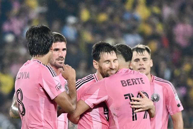 Inter Miami's Argentine forward #10 Lionel Messi (C) celebrates scoring his team's first goal during the friendly football match between Ecuador's Barcelona and the US' Inter Miami at the Banco Pichincha Stadium in Guayaquil, Ecuador, on February 7, 2026. (Photo by Marcos PIN / AFP)
