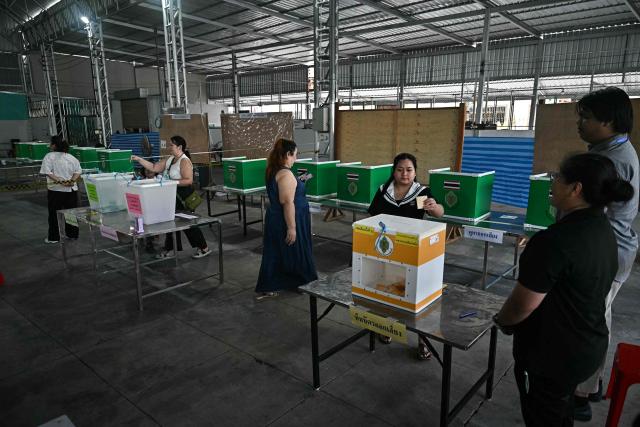 Voters cast their ballots in Thailand's general election in Bangkok on February 8, 2026. Voting opened on February 8 in a Thai general election pitting the popular reformists who came first last time against the conservative who ended up as prime minister, with ex-leader Thaksin Shinawatra looming large from his prison cell. (Photo by Lillian SUWANRUMPHA / AFP)