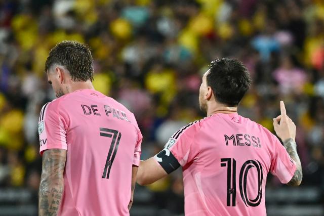 TOPSHOT - Inter Miami's Argentine forward #10 Lionel Messi (R) celebrates after scoring his team's first goal with teammate Argentine midfielder #07 Rodrigo De Paul (L) during the friendly football match between Ecuador's Barcelona and the US' Inter Miami at the Banco Pichincha Stadium in Guayaquil, Ecuador, on February 7, 2026. (Photo by MARCOS PIN / AFP)