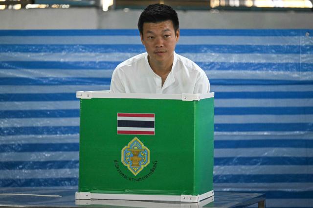 People's Party leader and prime ministerial candidate Natthaphong Ruengpanyawut prepares to vote in Thailand's general election at a polling station in Bangkok on February 8, 2026. Voting opened on February 8 in a Thai general election pitting the popular reformists who came first last time against the conservative who ended up as prime minister, with ex-leader Thaksin Shinawatra looming large from his prison cell. (Photo by Lillian SUWANRUMPHA / AFP)