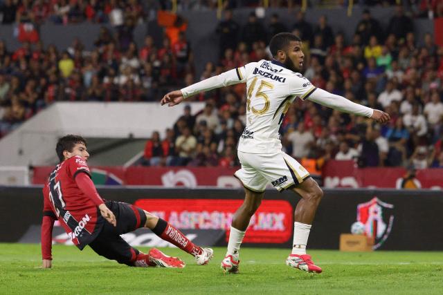 Pumas' Ecuadorian midfielder #45 Pedro Vite (R) reacts after scoring his team's first goal during the Liga MX Clausura tournament football match between Atlas and Pumas at Jalisco Stadium in Guadalajara, Mexico, on February 7, 2026. (Photo by Roberto ANTILLON / AFP)