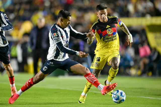 Monterrey's defender #02 Ricardo Chavez (L) and America's Uruguayan midfielder #07 Brian Rodriguez (R) fight for the ball during the Liga MX Clausura tournament football match between America and Monterrey at Ciudad de los Deportes Stadium in Mexico City on February 7, 2026. (Photo by Yuri CORTEZ / AFP)