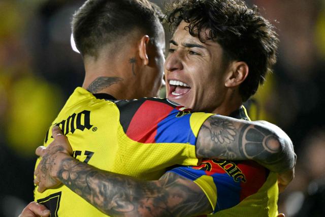 America's US forward #10 Alejandro Zendejas (R) celebrates scoring his team's first goal with teammate Uruguayan midfielder #07 Brian Rodriguez (L) during the Liga MX Clausura tournament football match between America and Monterrey at Ciudad de los Deportes Stadium in Mexico City on February 7, 2026. (Photo by Yuri CORTEZ / AFP)