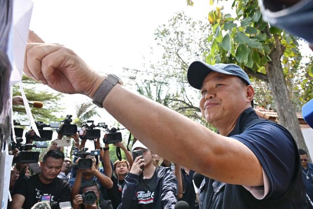 Thailand's Prime Minister and Bhumjaithai Party leader Anutin Charnvirakul arrives to vote in Thailand's general election at a polling station in Buriram province on February 8, 2026. Thais voted on February 8 in an election pitting the popular reformists who came first last time against the conservative who ended up as prime minister, with ex-leader Thaksin Shinawatra looming large from his prison cell. (Photo by ANTHONY WALLACE / AFP)