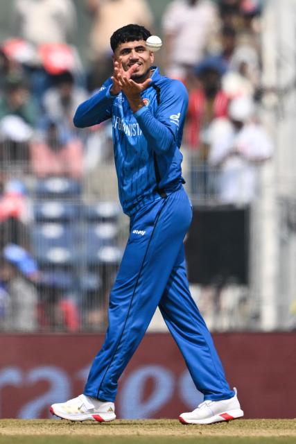 Afghanistan's Mujeeb Ur Rahman prepares to deliver a ball during the 2026 ICC Men's T20 Cricket World Cup group stage match between Afghanistan and New Zealand at the MA Chidambaram Stadium in Chennai on February 8, 2026. (Photo by R. Satish BABU / AFP)