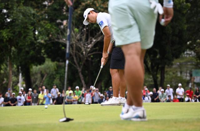 Cho Woo-young of South Korea putts during the final round of the Philippines Golf Championship at Wack Wack Golf and Country Club in Manila on February 8, 2026. (Photo by Ted ALJIBE / AFP)