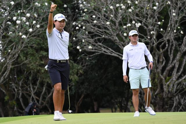 Cho Woo-young of South Korea celebrates after winning the Philippines Golf Championship at Wack Wack Golf and Country Club in Manila on February 8, 2026. (Photo by Ted ALJIBE / AFP)