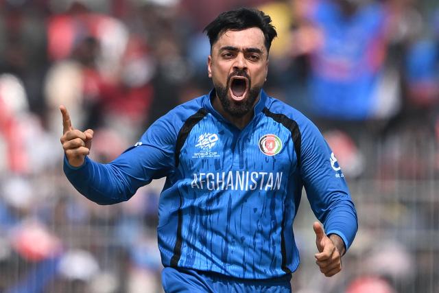 Afghanistan's captain Rashid Khan celebrates after taking the wicket of New Zealand's Glenn Phillips during the 2026 ICC Men's T20 Cricket World Cup group stage match between Afghanistan and New Zealand at the MA Chidambaram Stadium in Chennai on February 8, 2026. (Photo by R. Satish BABU / AFP)