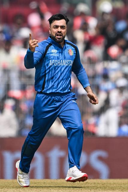 Afghanistan's captain Rashid Khan celebrates after taking the wicket of New Zealand's Glenn Phillips during the 2026 ICC Men's T20 Cricket World Cup group stage match between Afghanistan and New Zealand at the MA Chidambaram Stadium in Chennai on February 8, 2026. (Photo by R. Satish BABU / AFP)