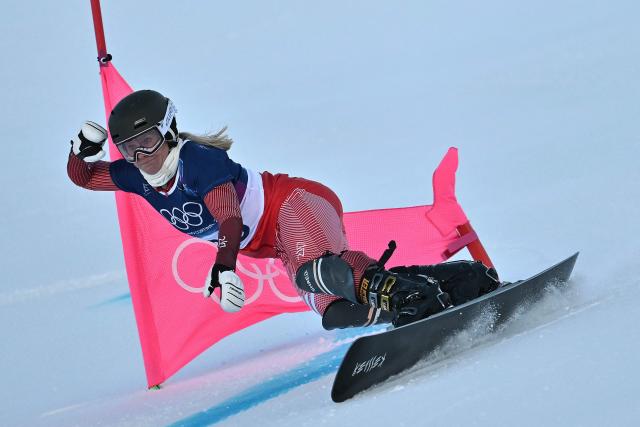 Switzerland's Julie Zogg competes in the snowboard women's parallel giant slalom qualification run at Livigno Snow Park during the Milano Cortina 2026 Winter Olympic Games, in Livigno (Valtellina), on February 8, 2026. (Photo by Jeff PACHOUD / AFP)