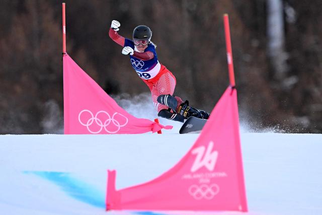 Switzerland's Julie Zogg competes in the snowboard women's parallel giant slalom qualification run at Livigno Snow Park during the Milano Cortina 2026 Winter Olympic Games, in Livigno (Valtellina), on February 8, 2026. (Photo by Kirill KUDRYAVTSEV / AFP)