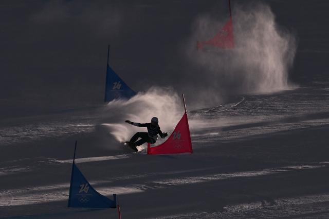 Slovenia's Gloria Kotnikv competes in the snowboard women's parallel giant Slalom elimination run at Livigno Snow Park during the Milano Cortina 2026 Winter Olympic Games, in Livigno (Valtellina), on February 8, 2026. (Photo by Jeff PACHOUD / AFP)