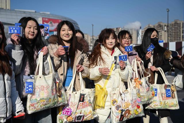 People visit iQIYI LAND, a new entertainment theme park developed by China's online entertainment platform iQIYI, on its opening day in Yangzhou, in eastern China's Jiangsu province on February 8, 2026. (Photo by Jade GAO / AFP)