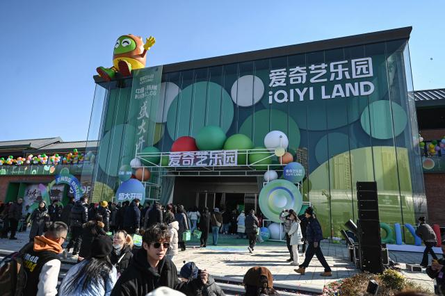 People visit iQIYI LAND, a new entertainment theme park developed by China's online entertainment platform iQIYI, on its opening day in Yangzhou, in eastern China's Jiangsu province on February 8, 2026. (Photo by Jade GAO / AFP)