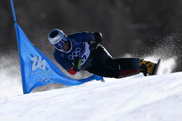 Austria's Benjamin Karl competes in the snowboard men's parallel giant slalom elimination run at Livigno Snow Park during the Milano Cortina 2026 Winter Olympic Games, in Livigno (Valtellina), on February 8, 2026. (Photo by Kirill KUDRYAVTSEV / AFP)