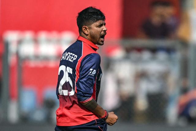 Nepal's Sandeep Lamichhane celebrates after taking the wicket of England's Tom Banton during the 2026 ICC Men's T20 Cricket World Cup group stage match between England and Nepal at the Wankhede Stadium in Mumbai on February 8, 2026. (Photo by Indranil MUKHERJEE / AFP)