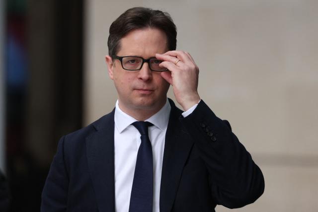 Britain's main opposition Conservative Party Shadow Chancellor of the Duchy of Lancaster and Northern Ireland Secretary Alex Burghart leaves the BBC building in central London on February 8, 2026, after an appearance on the BBC's 'Sunday' political television show. (Photo by Adrian Dennis / AFP)