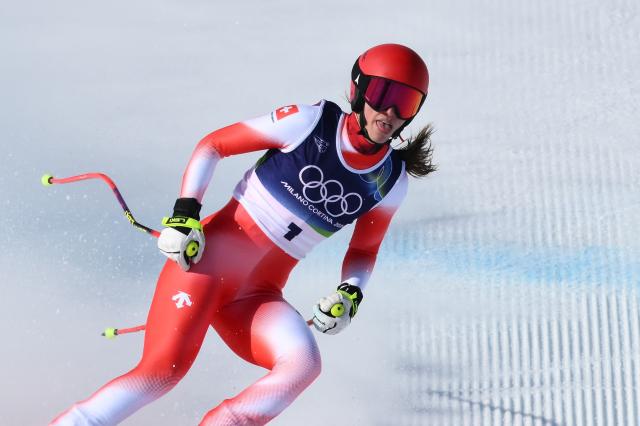 Switzerland's Malorie Blanc reacts in the finish area of the women's downhill event during the Milano Cortina 2026 Winter Olympic Games at the Tofane Alpine Skiing Centre in Cortina d’Ampezzo on February 8, 2026. (Photo by Marco BERTORELLO / AFP)