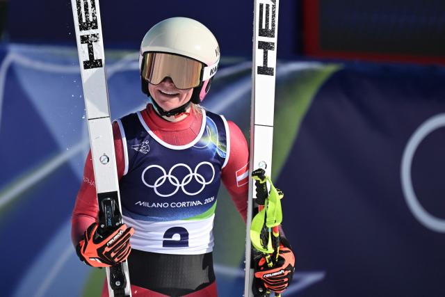 Austria's Ariane Raedler reacts in the finish area after competing in the women's downhill event during the Milano Cortina 2026 Winter Olympic Games at the Tofane Alpine Skiing Centre in Cortina d’Ampezzo on February 8, 2026. (Photo by Tiziana FABI / AFP)